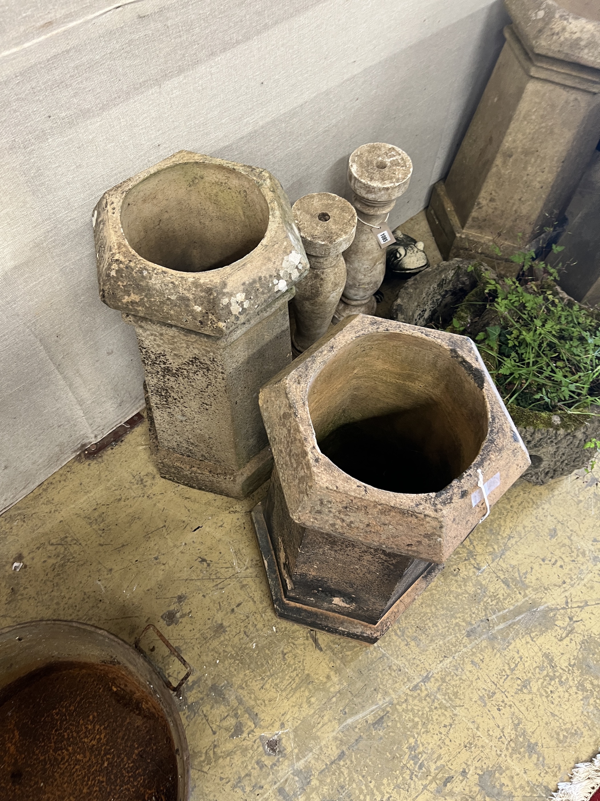 A pair of hexagonal terracotta chimney pots, larger height 71cm